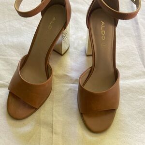 Sandal worn once with gold embossed heel